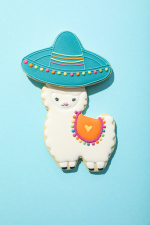 Llama with a sombrero on a blue background.の写真素材
