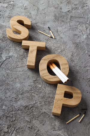 Smoking addiction concept, word: STOP, top view.の写真素材