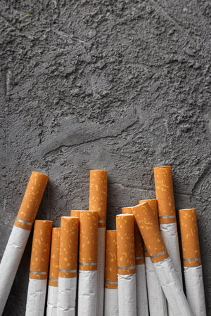 Concept of addiction to smoking, many cigarette filters, close-up.