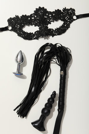 A collection of sex toys on a light background.の写真素材