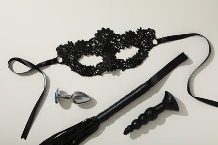 A collection of sex toys on a light background.の写真素材