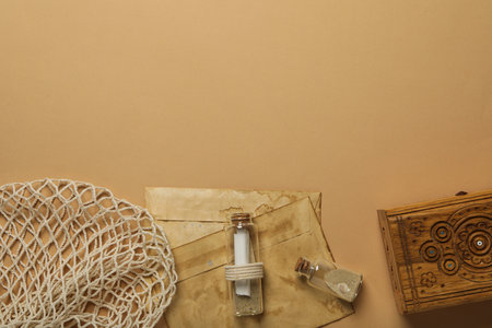 Columbus day. Old envelopes and a glass bottle with a letter insideの写真素材
