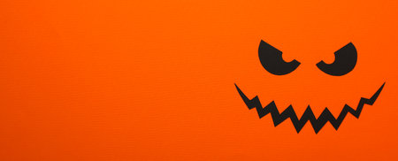 Paper eyes and mouth on orange background, space for textの写真素材