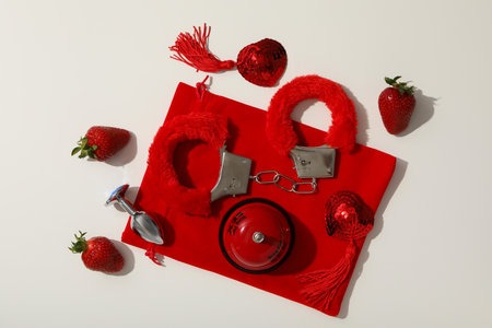 A collection of sex toys on a light background.の写真素材