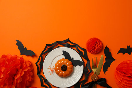 Table setting for Halloween, decorations with spiders and pumpkinsの写真素材