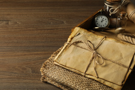 Columbus day. A pocket watch with a stack of old letters
