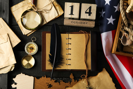 Columbus Day. Wooden calendar with notebook and American flagの写真素材