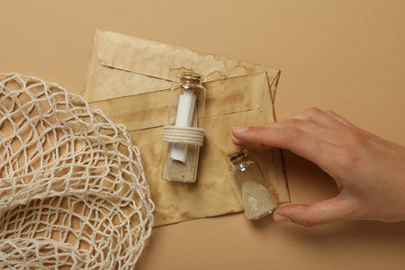 Columbus day. Old envelopes and a glass bottle with a letter insideの写真素材