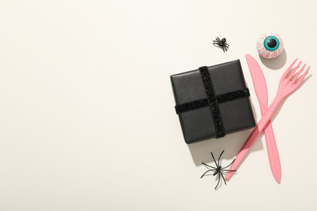 Pink cutlery with a gift in black packagingの写真素材