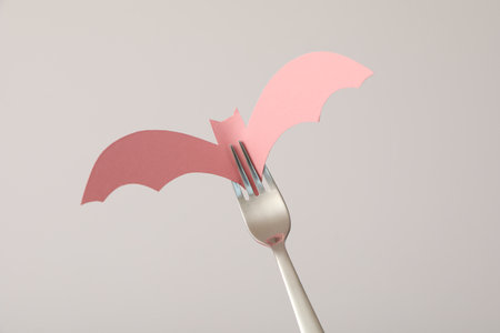 Table setting for Halloween, a bat on a forkの写真素材