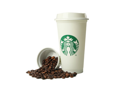 Ukraine, Kyiv, 08/24/2023: PNG, a cup of Starbucks coffee with coffee beans isolated on a white background.のeditorial素材