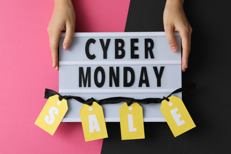 Cyber Monday message on table with gifts and laptop.の写真素材
