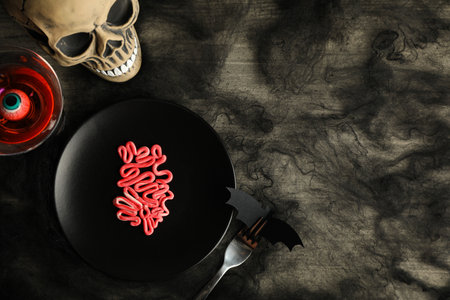 Spooky holiday table decorations with a skull for Halloweenの写真素材