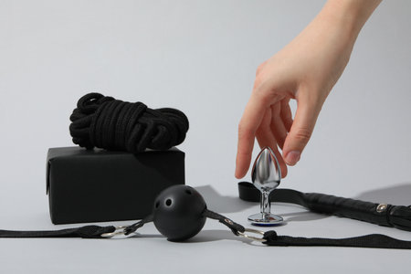 A collection of sex toys on a light background.