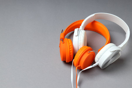 A pair of over-the-ear headphones on a light background.の写真素材