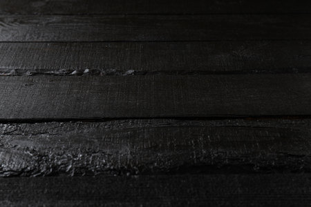 Black wooden background, close upの写真素材