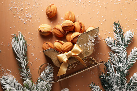 Beautiful sleigh with nut cookies on the tableの写真素材