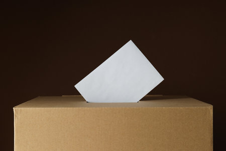 Paper ballot box with paper on black backgroundの写真素材