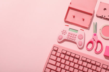 Keyboard, calculator, cassette and scissors on pink background, space for textの写真素材