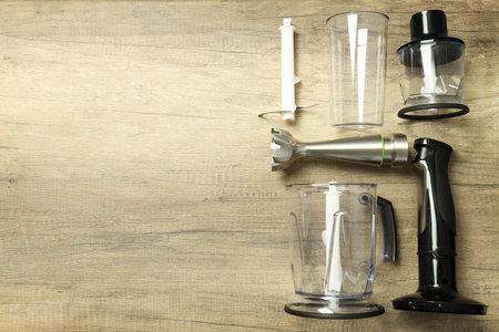 Black blender with attachments on wooden background, space for textの写真素材