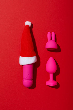 Sex toys with Christmas Santa hat, top view.の写真素材