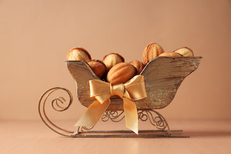 Beautiful sleigh with nut cookies on the table