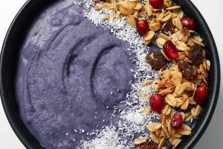 Bowl with smoothie and oatmeal on white background, top viewの写真素材
