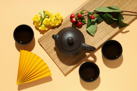 Asian tea concept, traditional dishes on yellow background.の写真素材