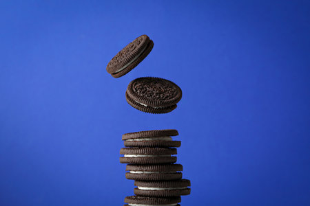 Ukraine, Kyiv 09/04/2023: Oreo cookies on a blue background.のeditorial素材