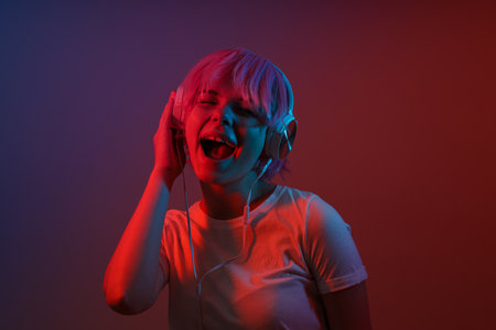 The girl dances in overhead, conductive headphones.