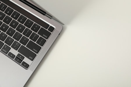 An open laptop on a white tableの写真素材