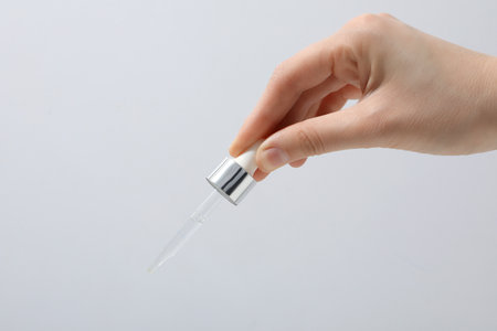Hyaluronic acid serum on a gray background.の写真素材