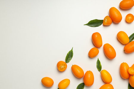 Kumquat and leaves on white background, space for textの写真素材