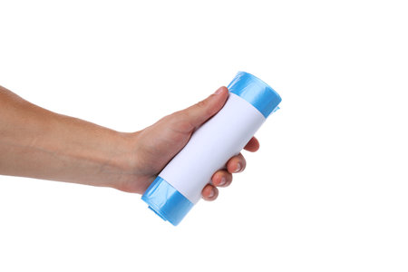 PNG, Roll of blue trash bag in hand, isolated on white backgroundの写真素材