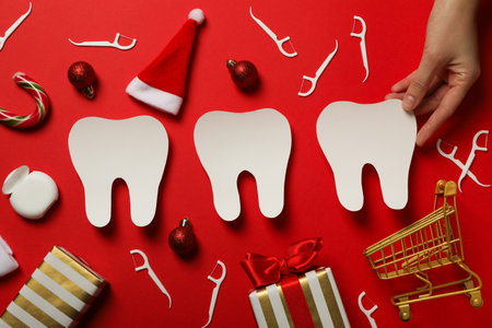 Teeth with Christmas accessories around, flat lay.の写真素材