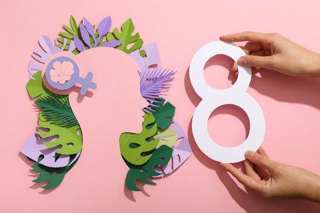 Paper female head with paper decorative leaves