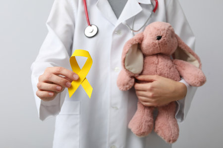 A soft toy rabbit in the hands of a doctorの写真素材