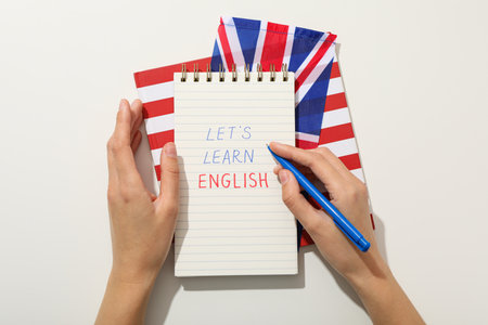 Notepad, Big Ben and the word "English" on a white background.の写真素材