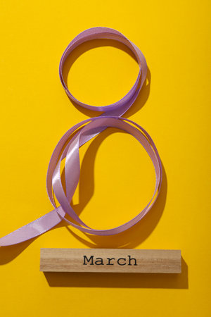 The number eight is made of satin ribbon
