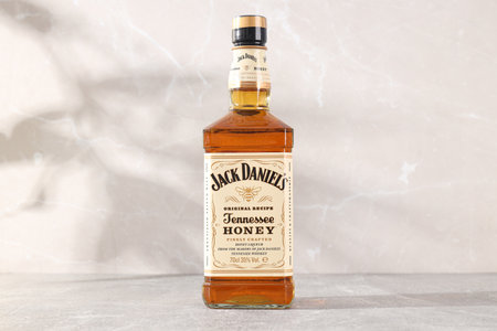 Ukraine, Kyiv, 01.11.2023, Jack Daniels whiskey on a light backgroundのeditorial素材