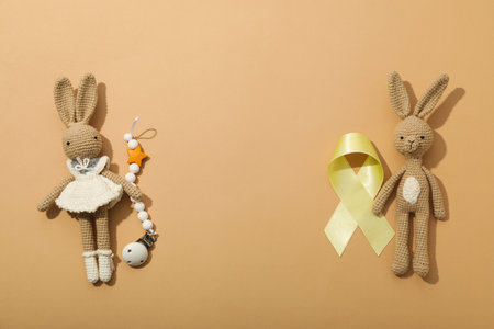 Soft toy bunnies with a yellow ribbonの写真素材