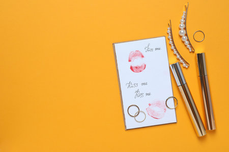 Imprint of a kiss on a letter on a yellow background.の写真素材