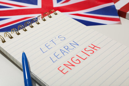 Notepad, Big Ben and the word "English" on a white background.の写真素材