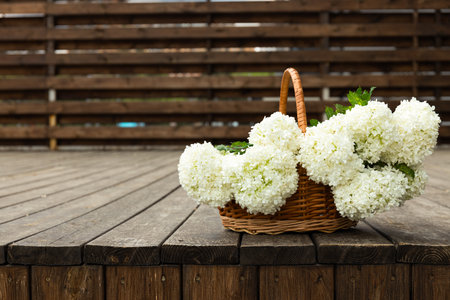 A basket filled with flowers on the street.の写真素材