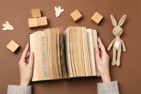 A children's book with toys on a beige background.の写真素材