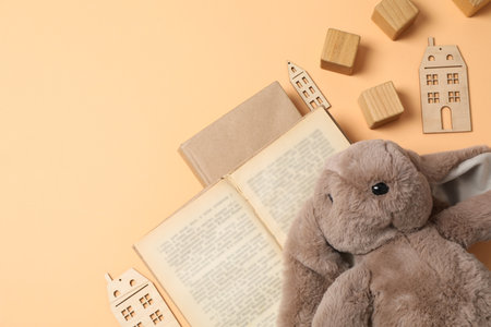 A children's book with toys on a beige background.の写真素材