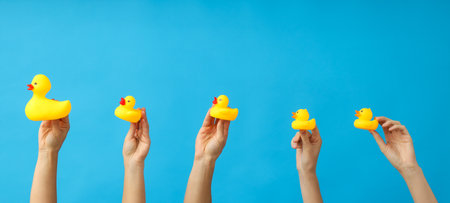 Things for children, in the hands of many women.の写真素材
