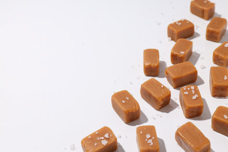 Cubes of salted caramel on a white backgroundの写真素材