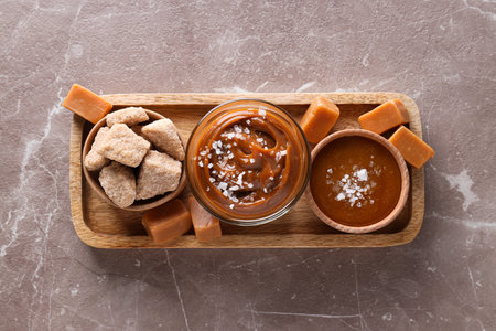 Cubes of salted caramel on a wooden trayの写真素材