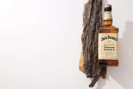Ukraine, Kyiv, 01.11.2023, Jack Daniels whiskey with a piece of barkのeditorial素材